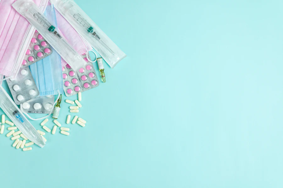 Medical consumable supplies arranged on a blue background
