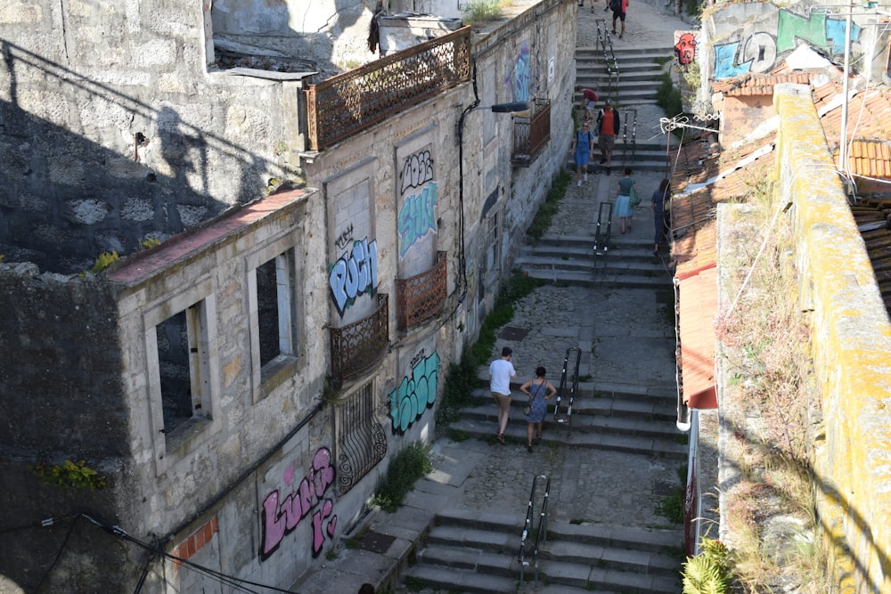 a couple of people that are walking down some stairs