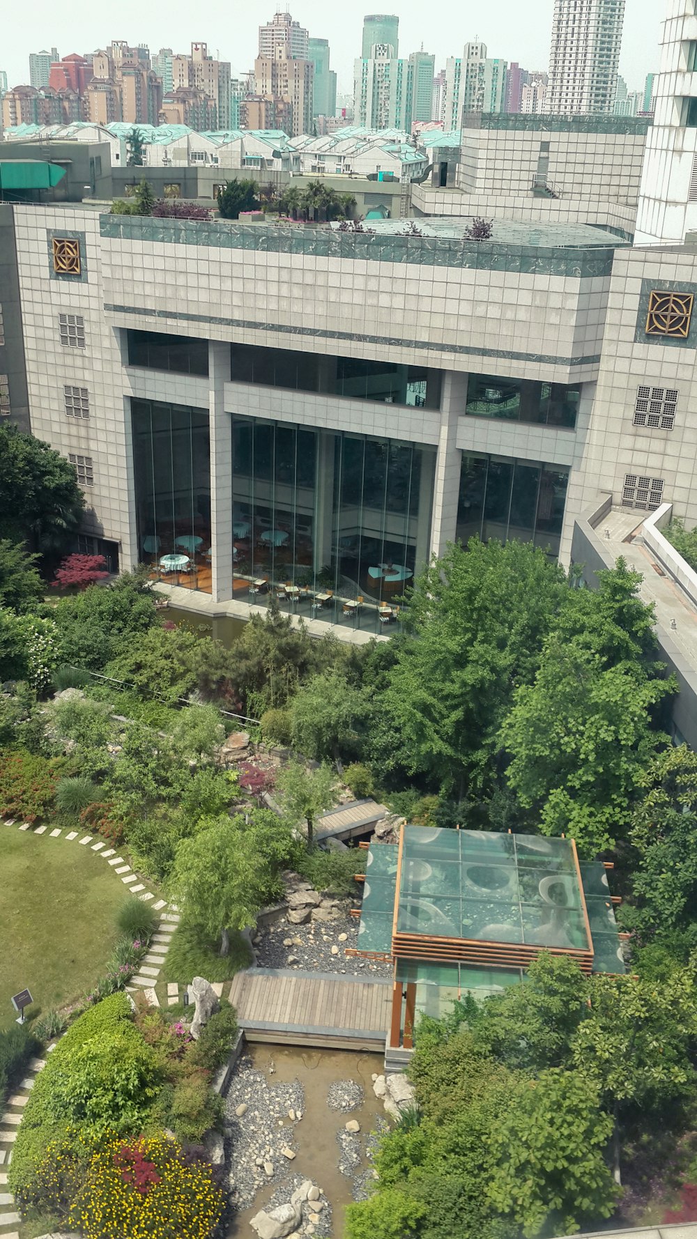 an aerial view of a building with a green roof