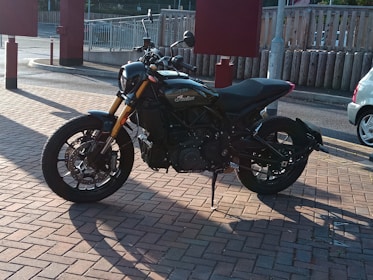 A sleek new motorcycle parked on a sunny street, ready for a ride.