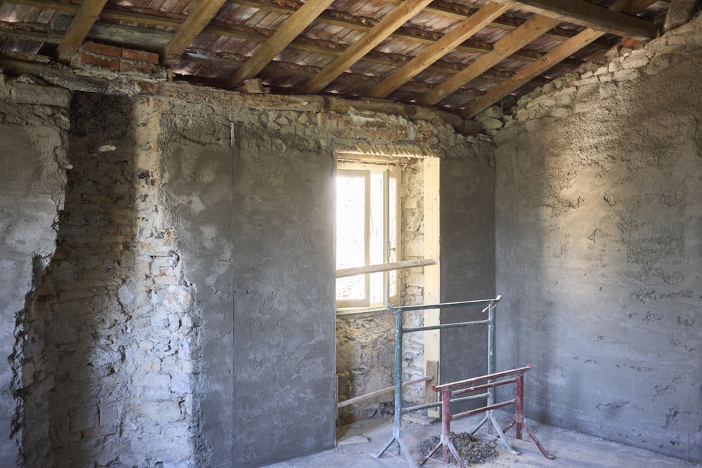 a room with a ladder and a window in it