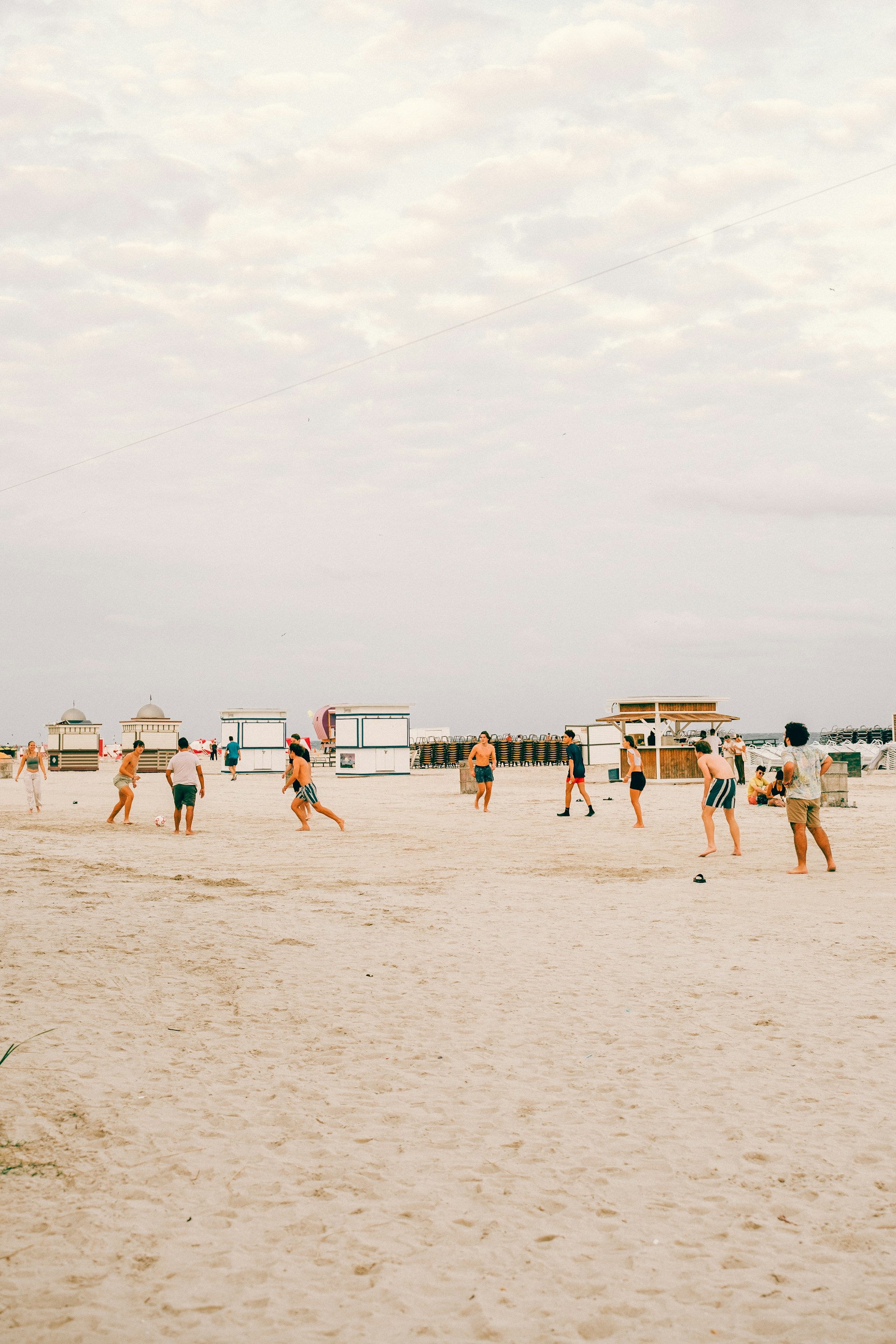 woman wearing yellow long-sleeved dress under white clouds and blue sky during daytime