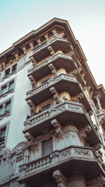 Historic Recoleta house with ornate balconies and classic architecture under a clear sky.