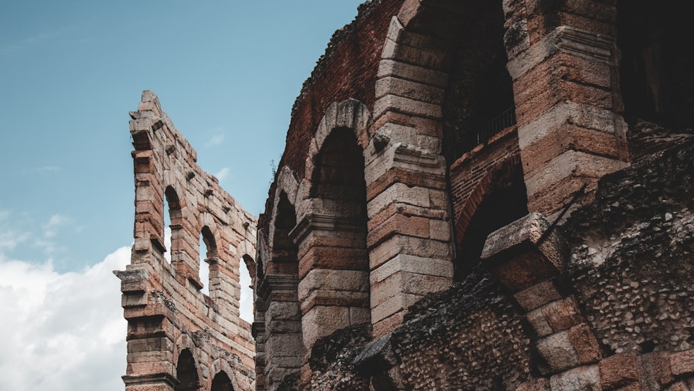 a very tall brick structure with a sky in the background