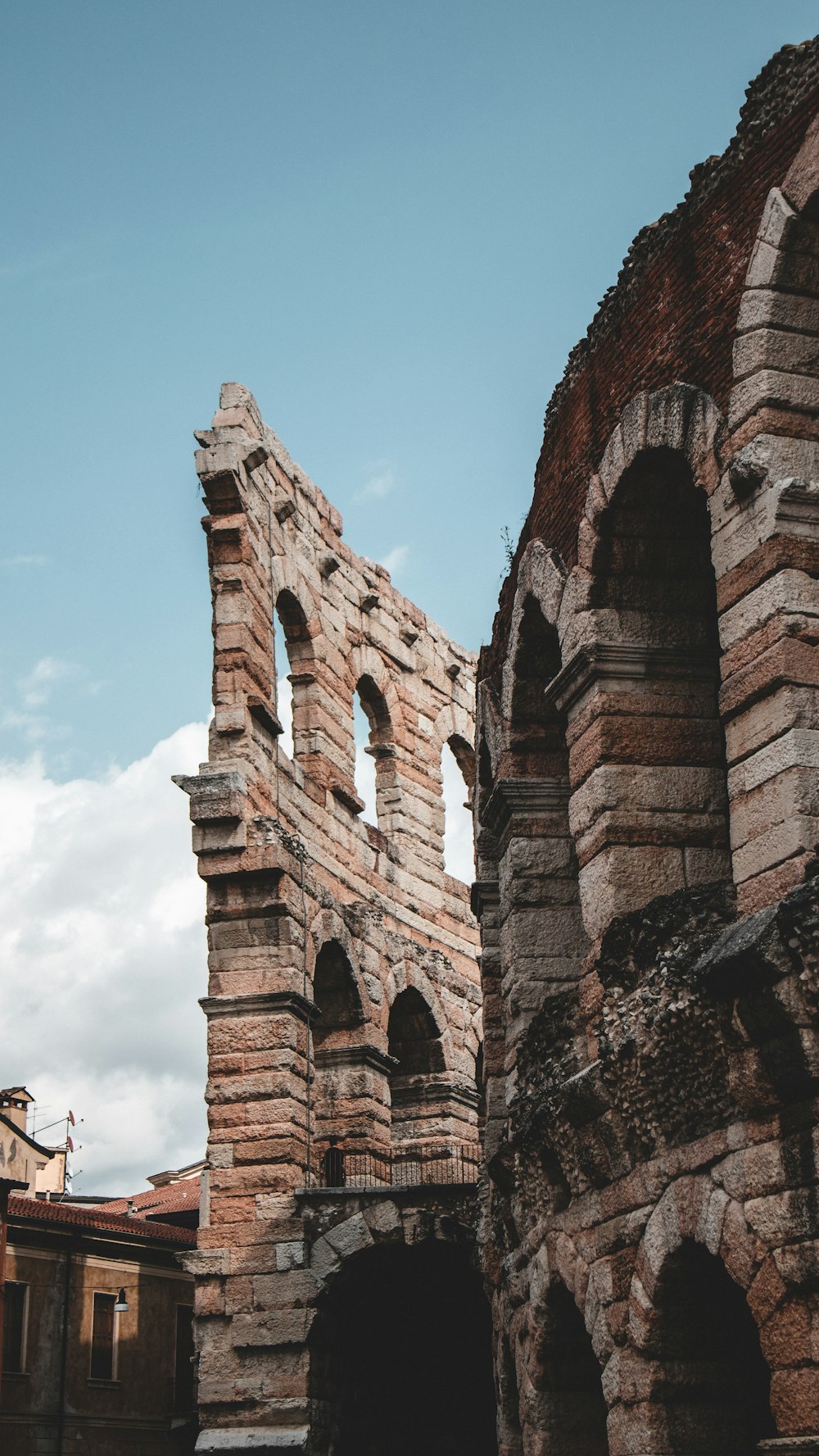 an old brick building with arches and arches