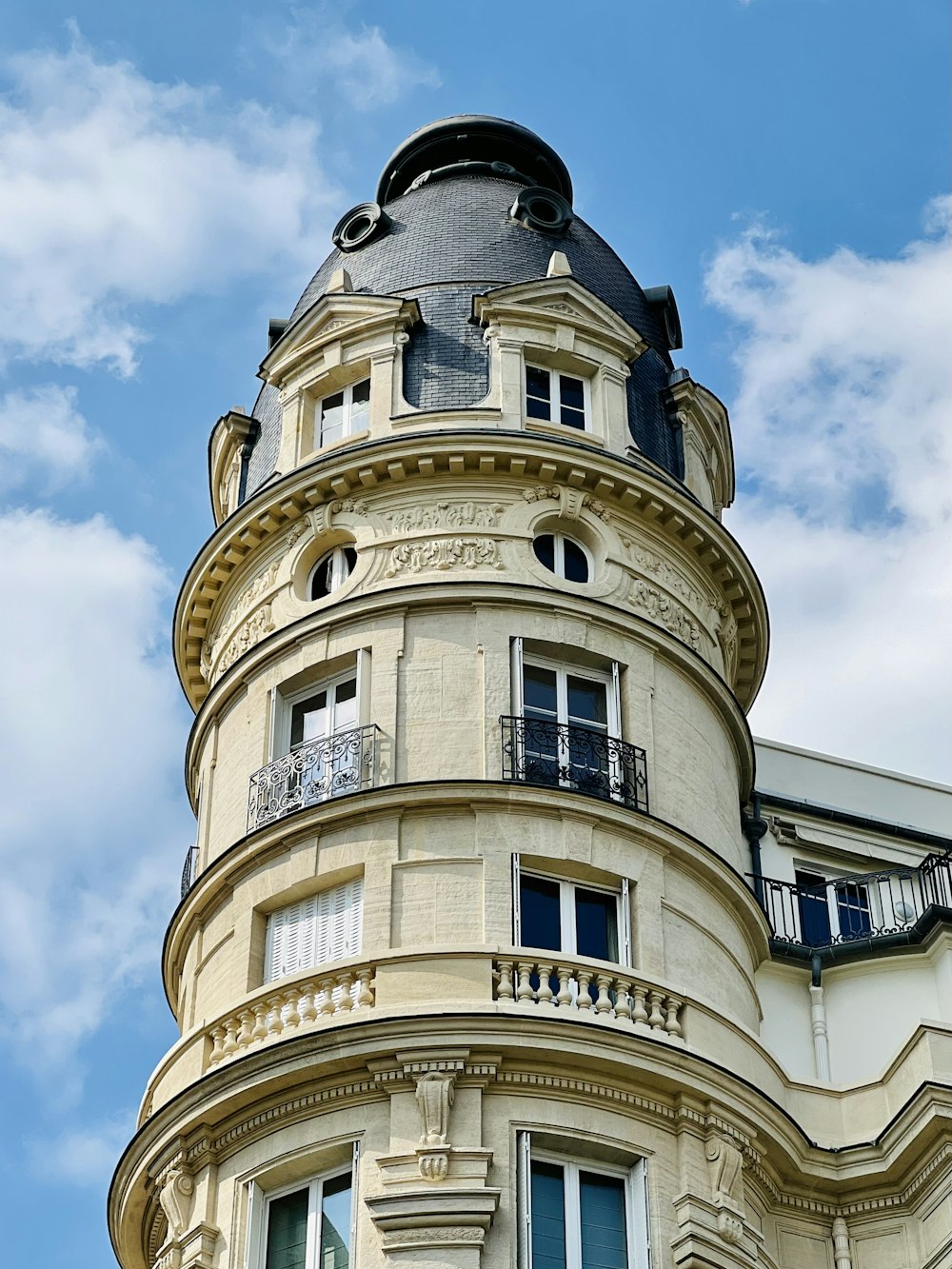 a very tall building with a clock on it's side