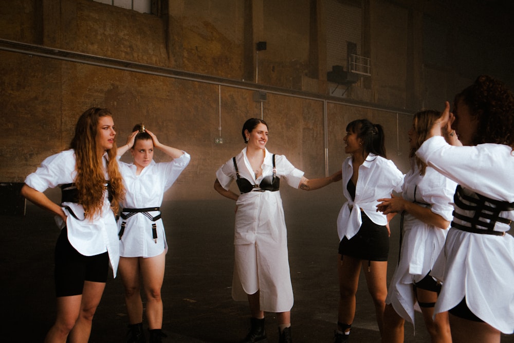 a group of young women standing next to each other