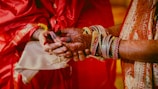 Close-up of hands demonstrating saree draping techniques during a course.