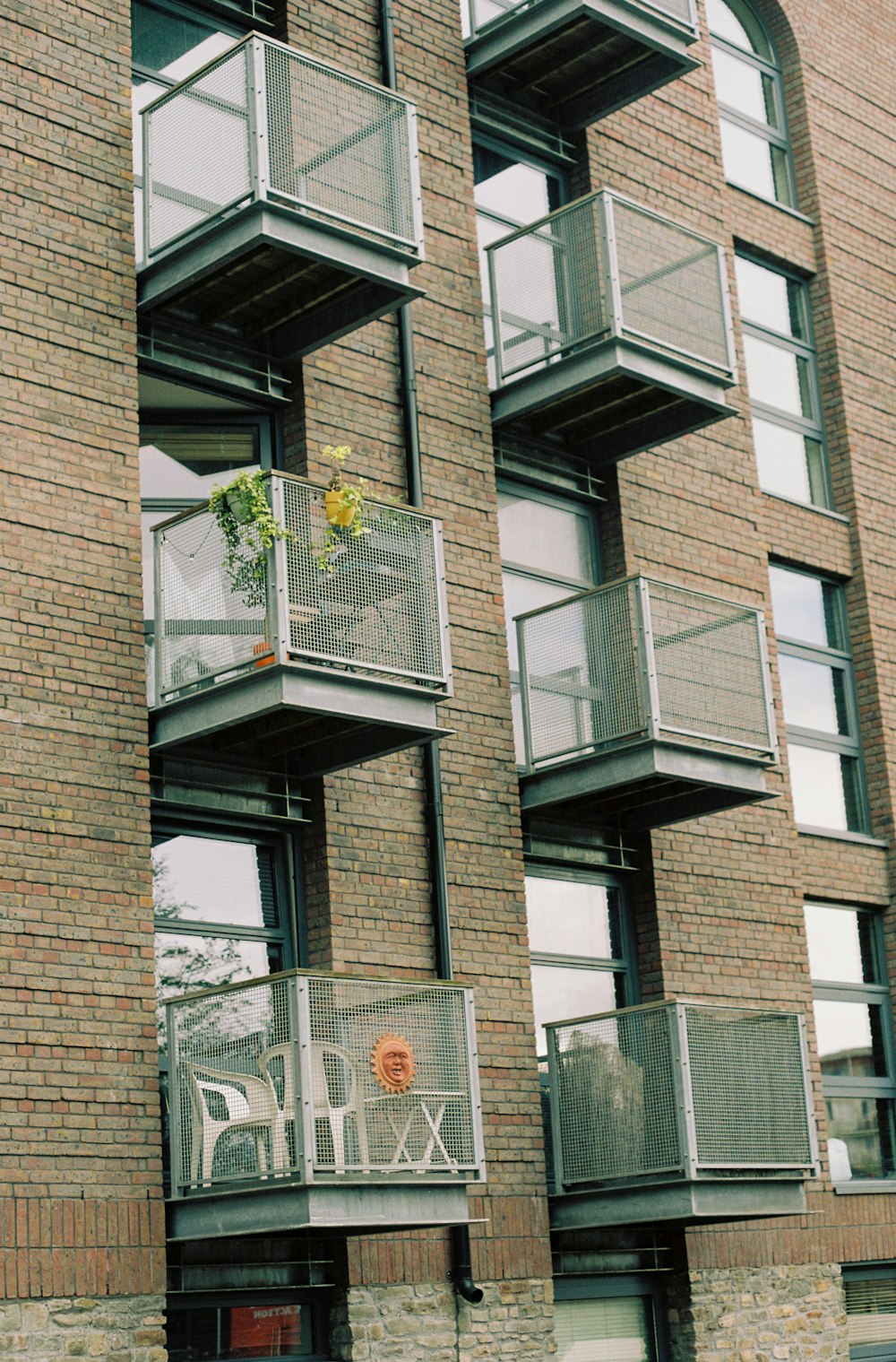 a tall brick building with balconies and balconies