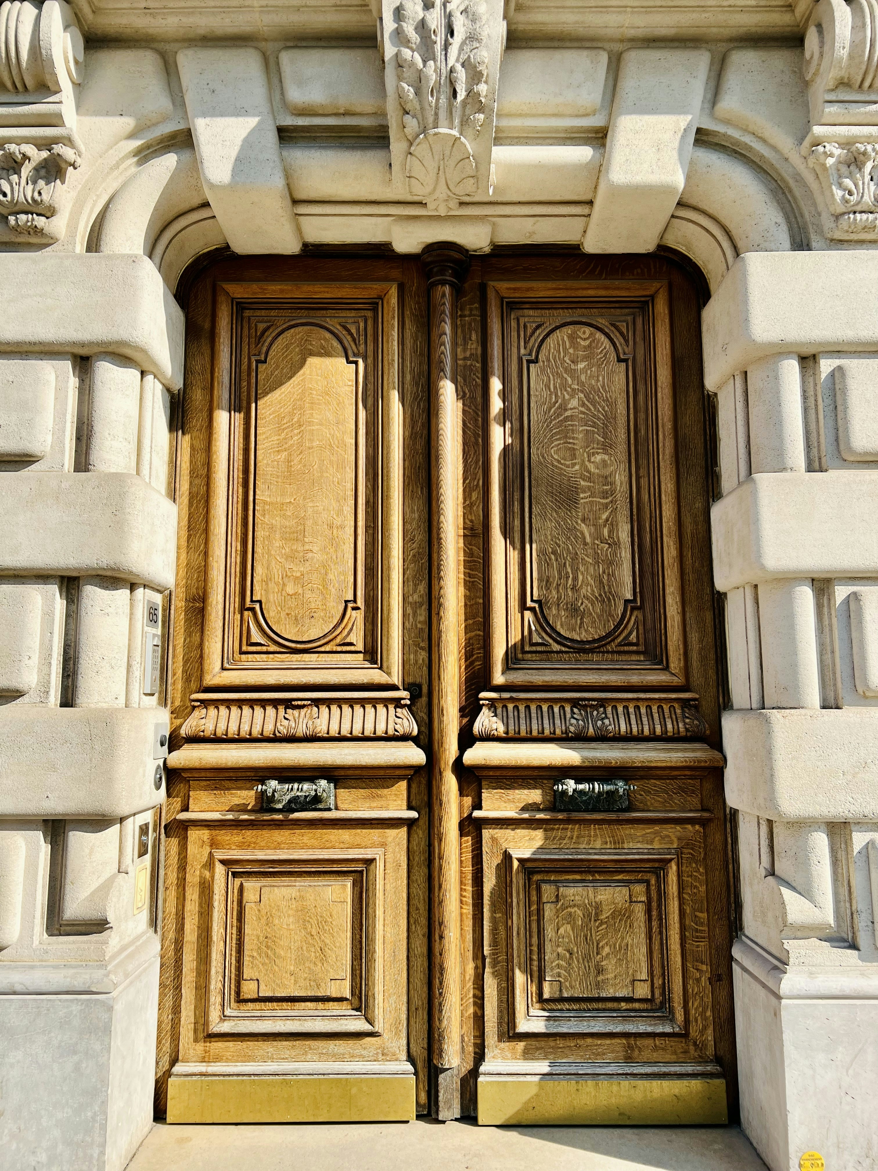 a close up of a wooden door on a building