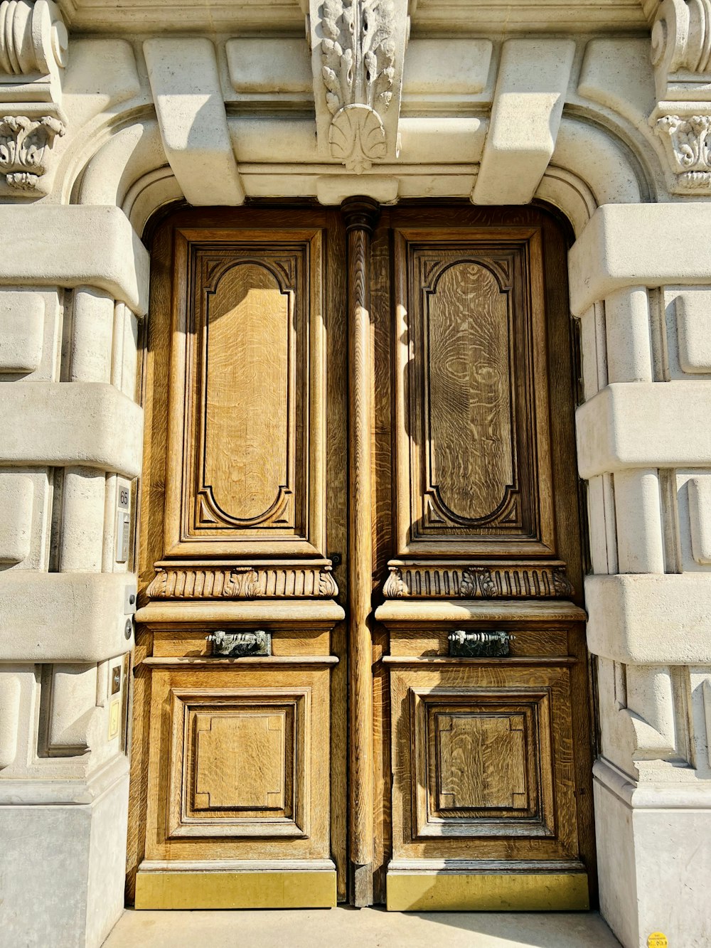 a close up of a wooden door on a building