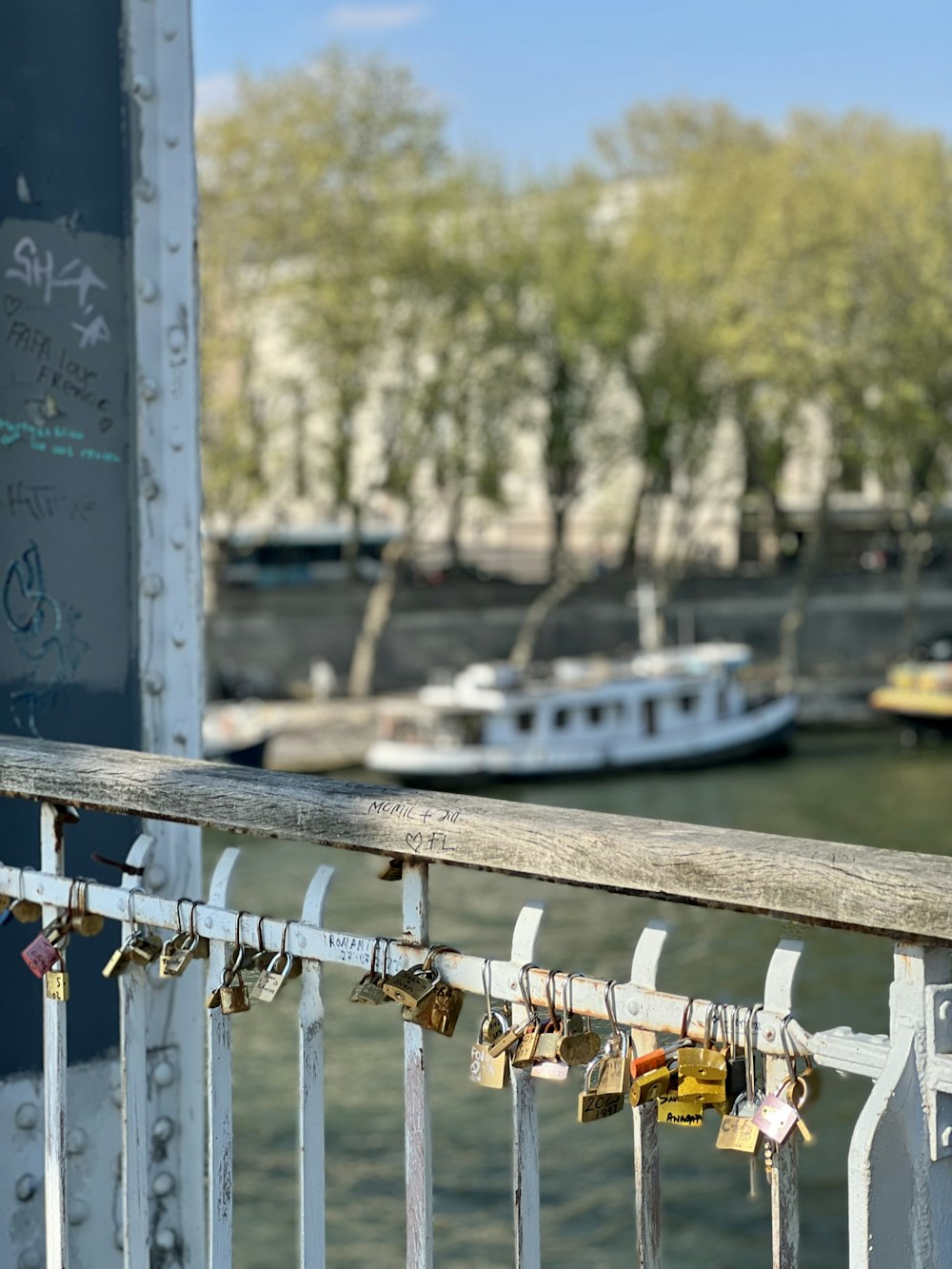 a bridge with a bunch of padlocks attached to it