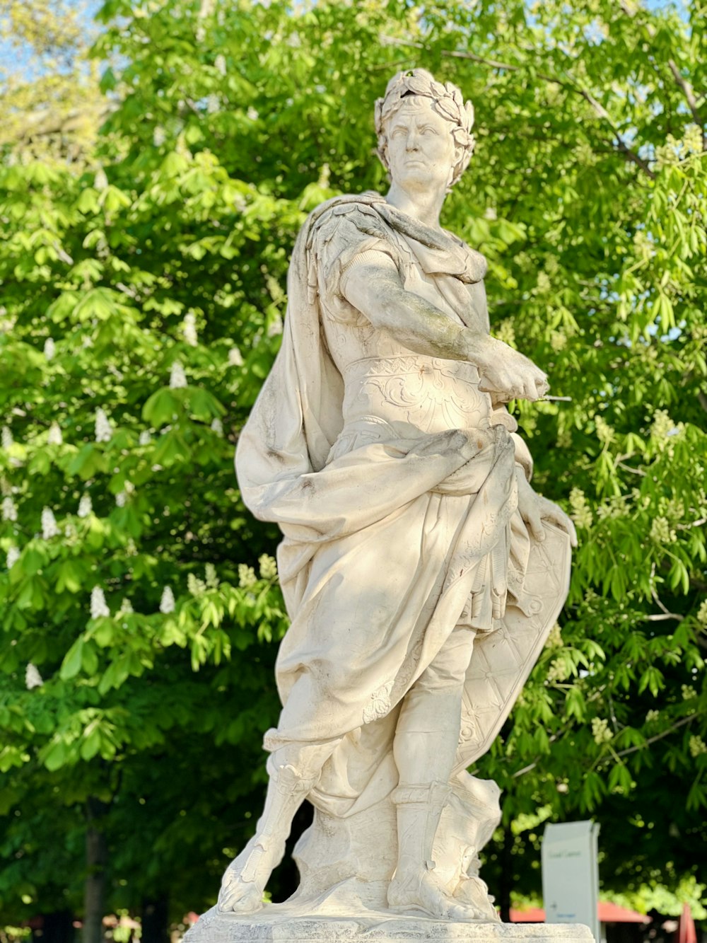 a statue of a woman in a park