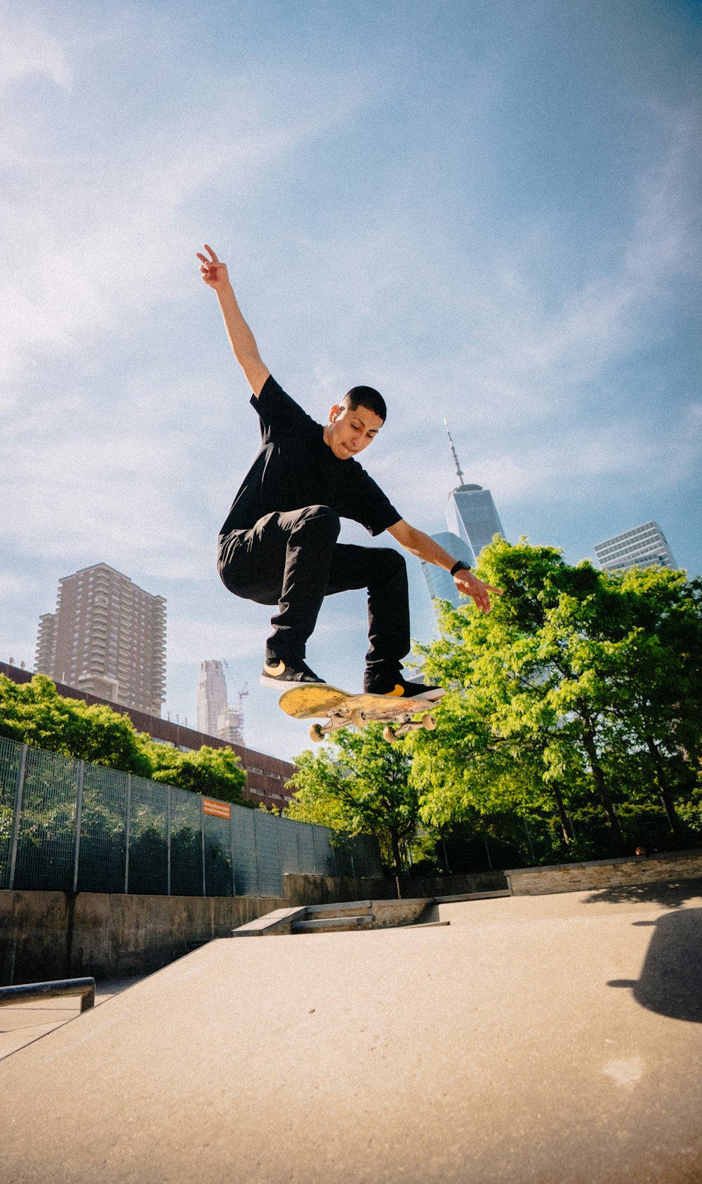 a man flying through the air while riding a skateboard