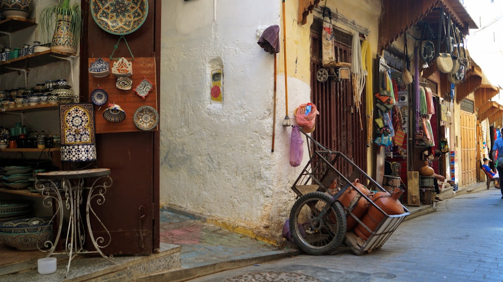 a bike parked on the side of a street next to a building