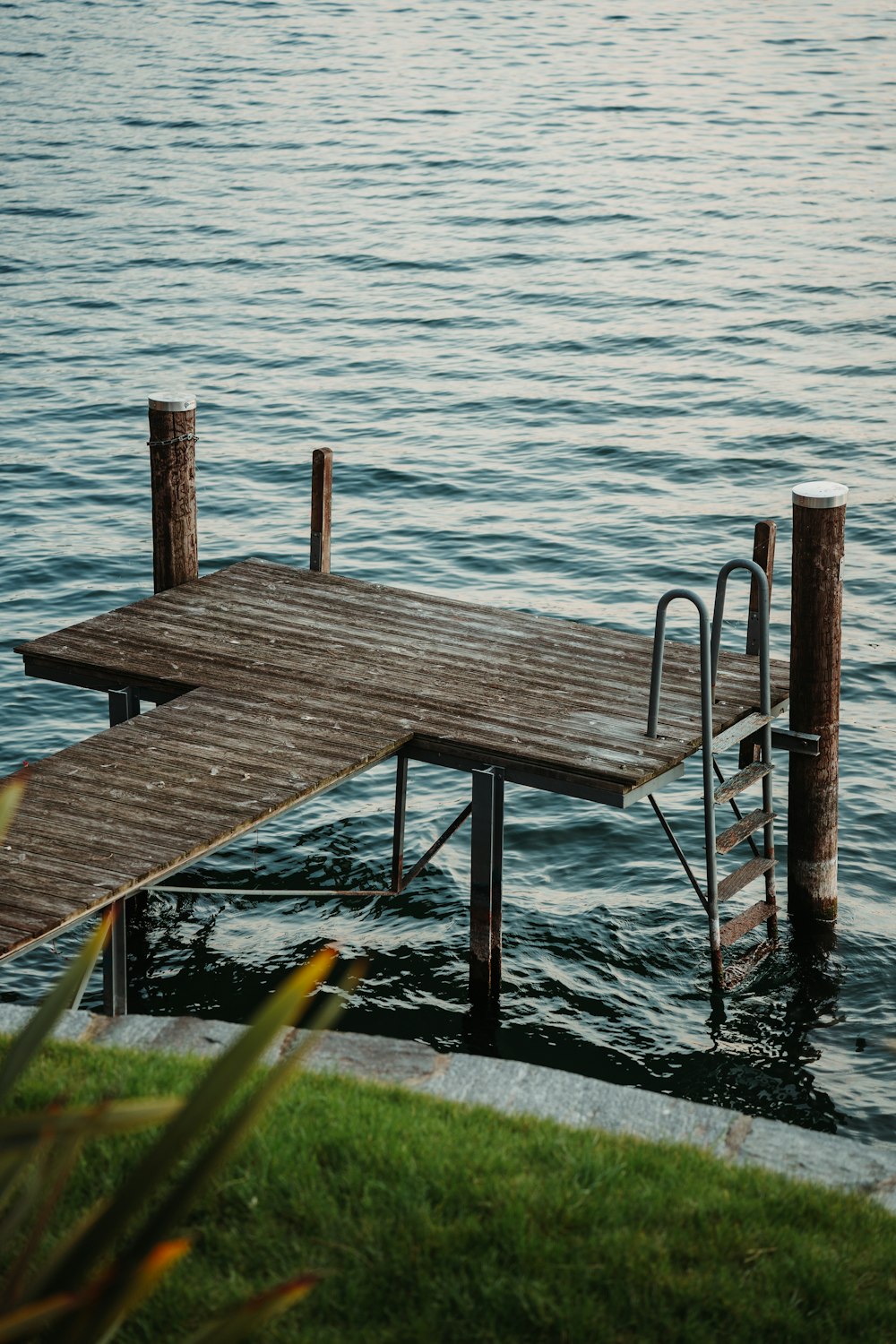 a wooden dock sitting on top of a body of water