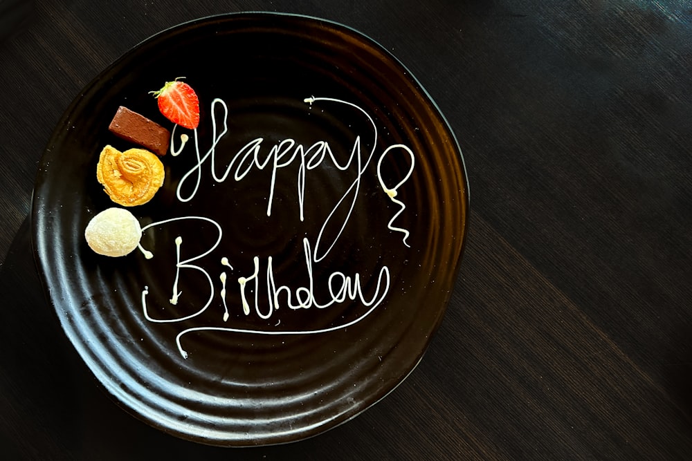 a plate with a happy birthday written on it