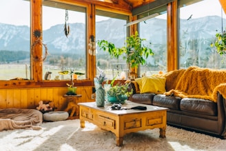 a living room filled with furniture and lots of windows