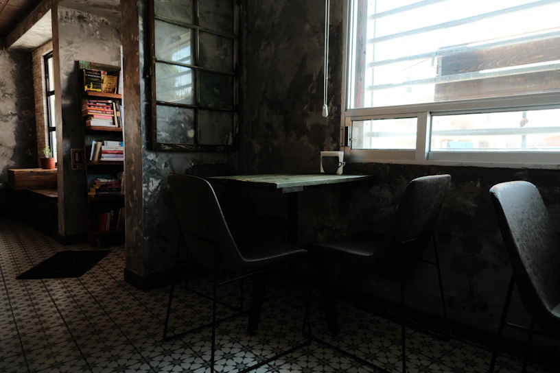 A cozy corner of the old house where the children gather to study by dim light.