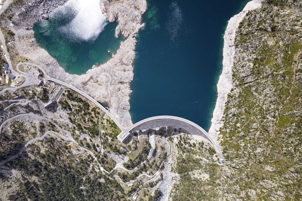 an aerial view of a bridge over a body of water