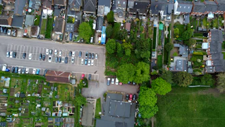 Aerial view of a planned residential neighborhood with green spaces and paved roads.