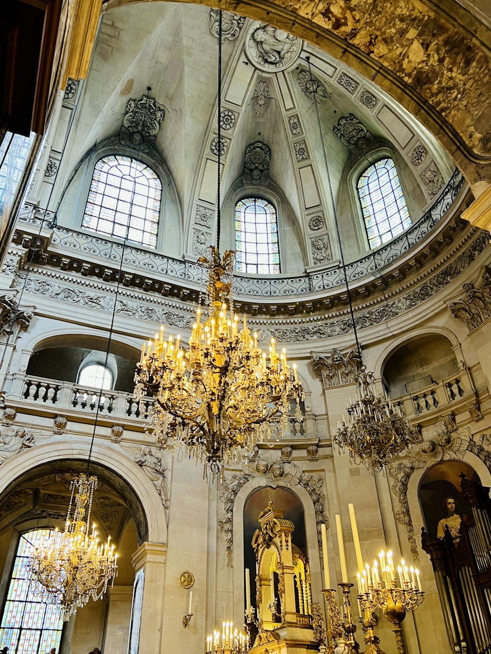 a chandelier hanging from the ceiling of a church