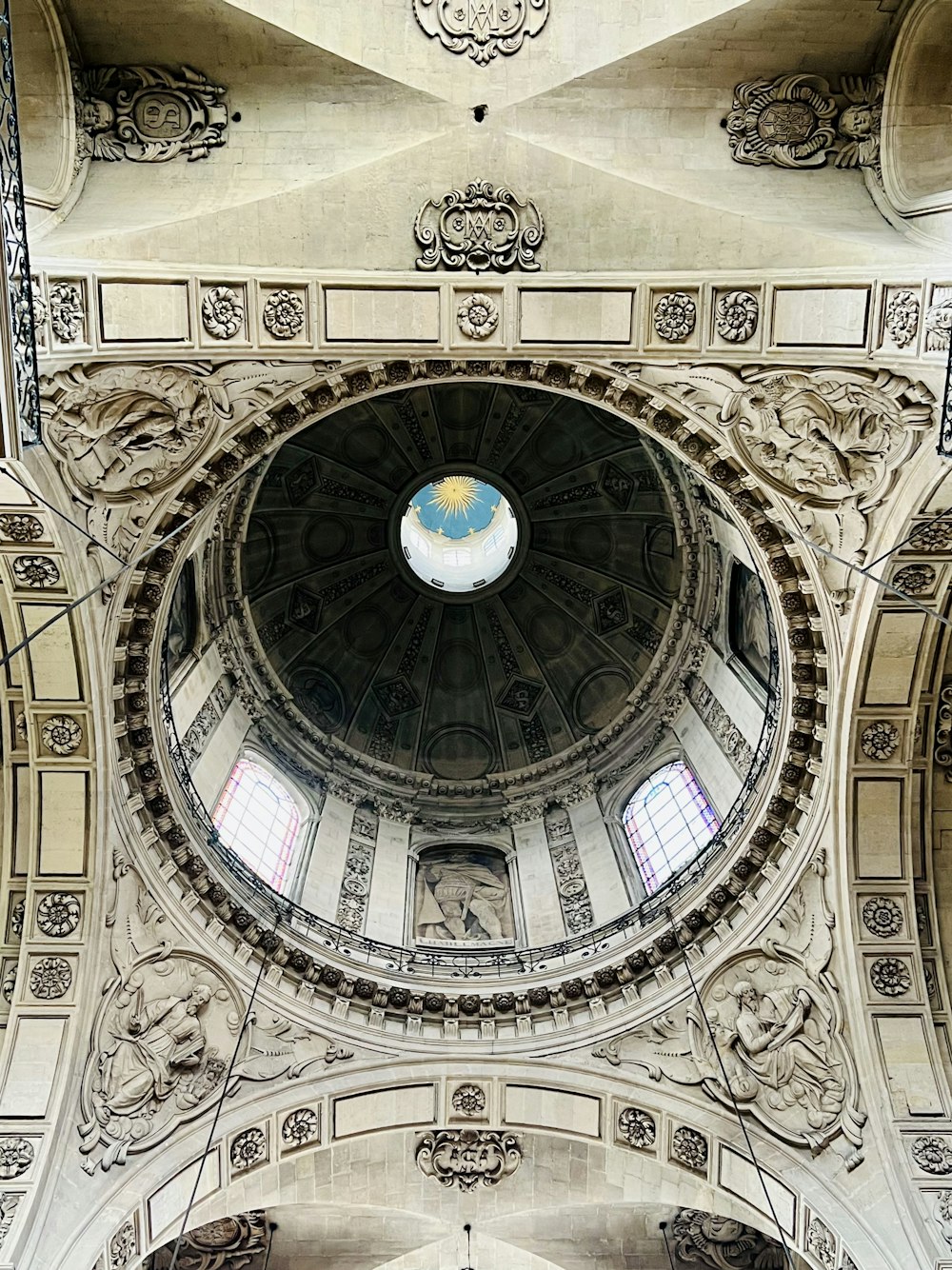 the ceiling of a large building with a dome