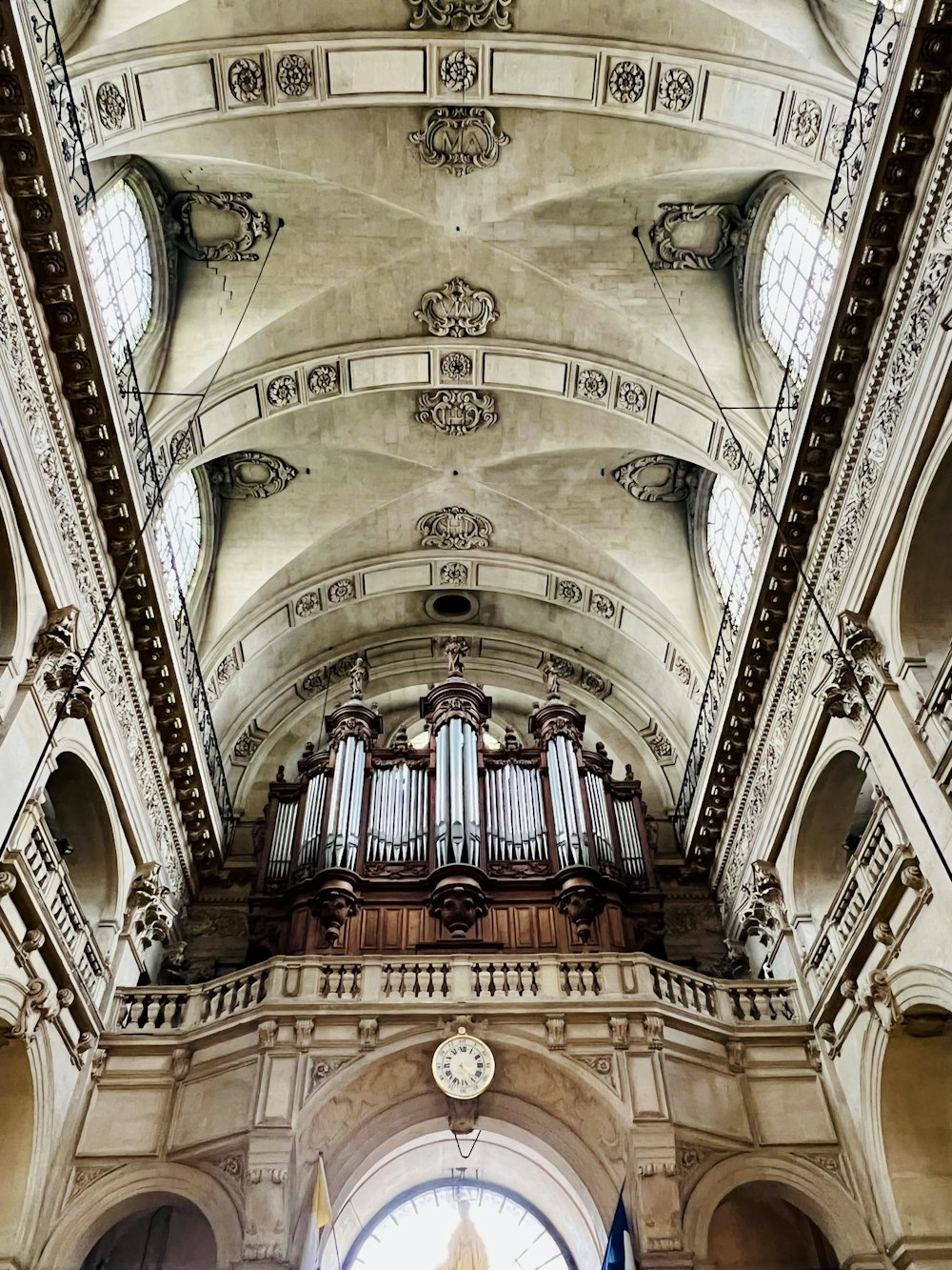 a large cathedral with a clock on the ceiling