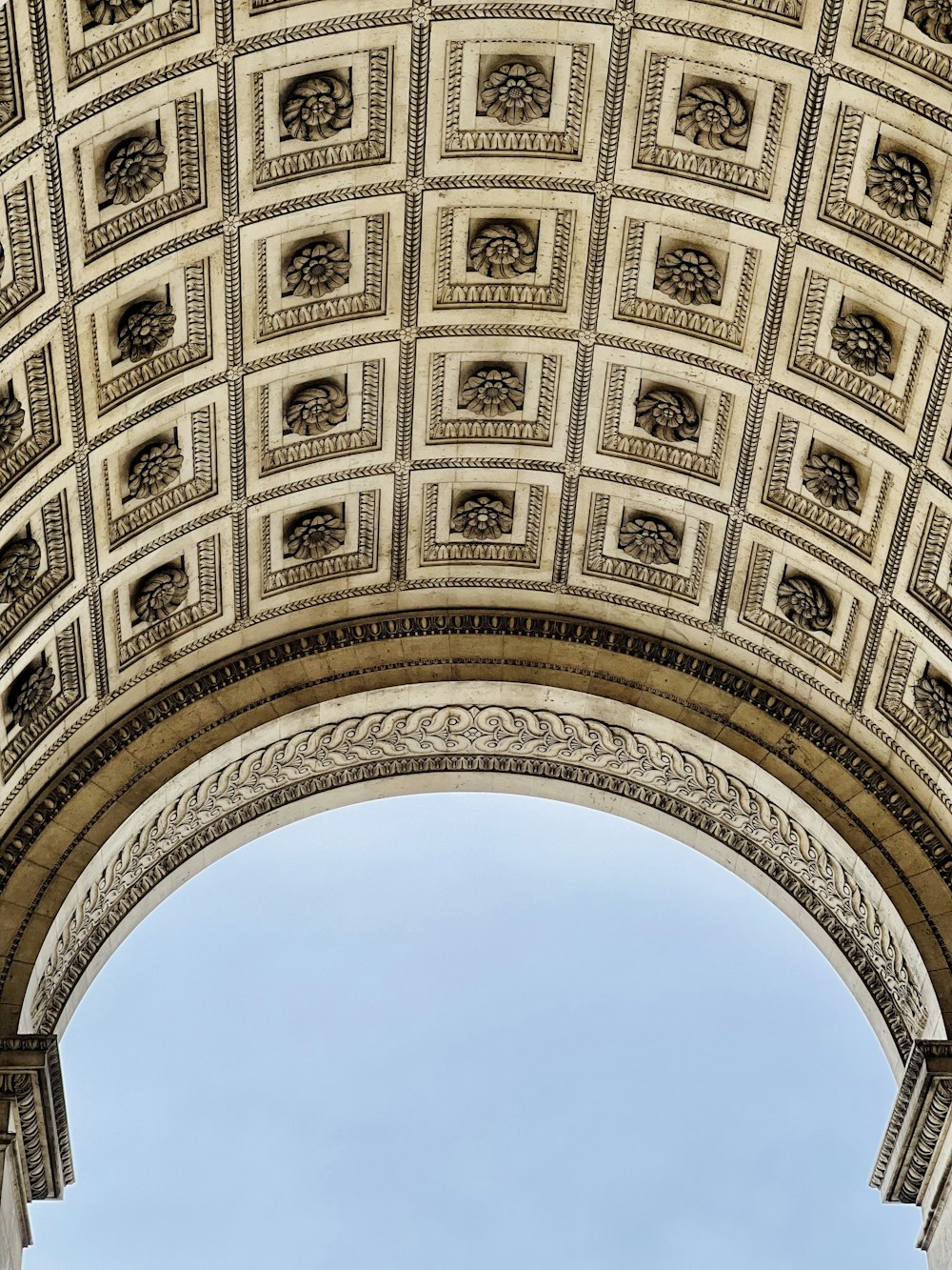 a view of the top of a building with a sky in the background