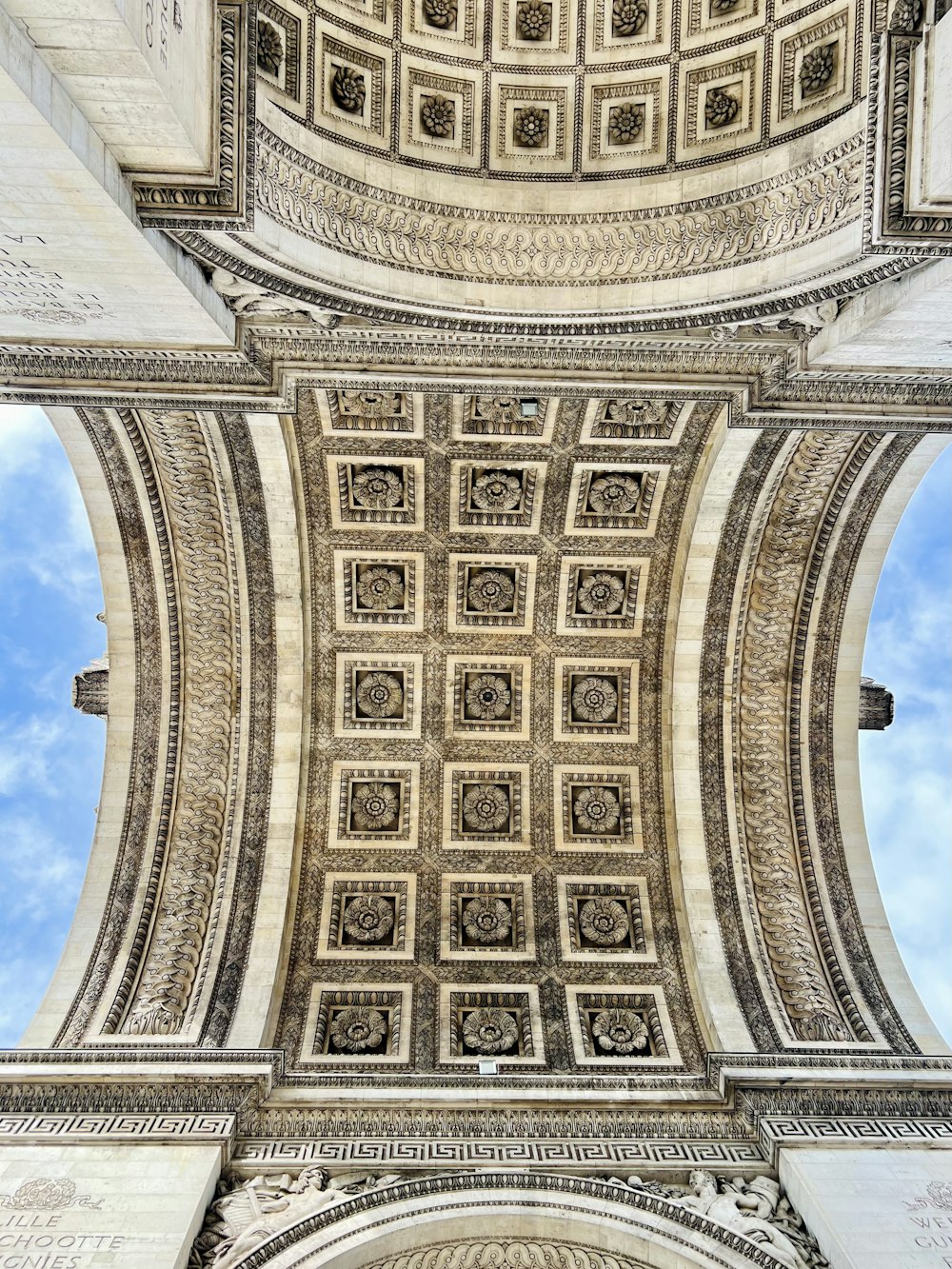 the ceiling of a building with a blue sky in the background