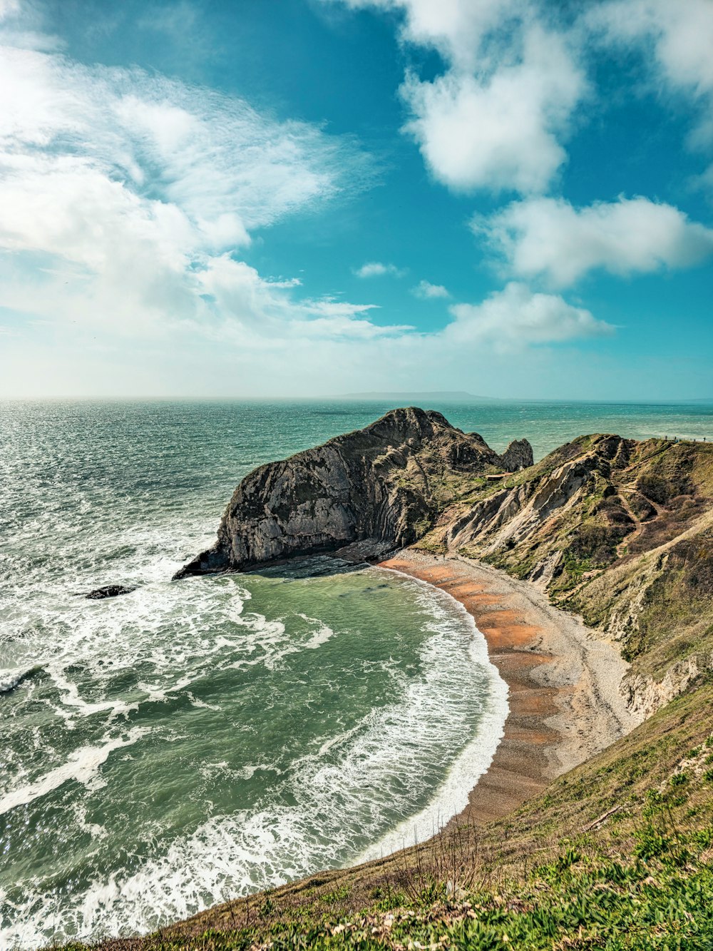 a view of the ocean from a cliff