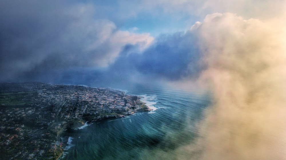 an aerial view of a city and a body of water