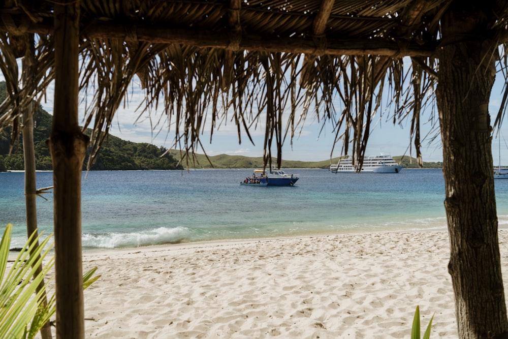 a beach with a boat in the water