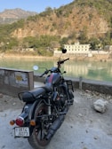 A scenic view of a bike parked near a river.