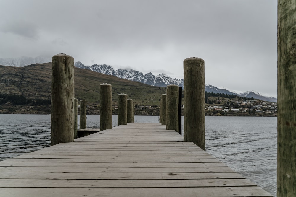 a wooden dock sitting next to a body of water