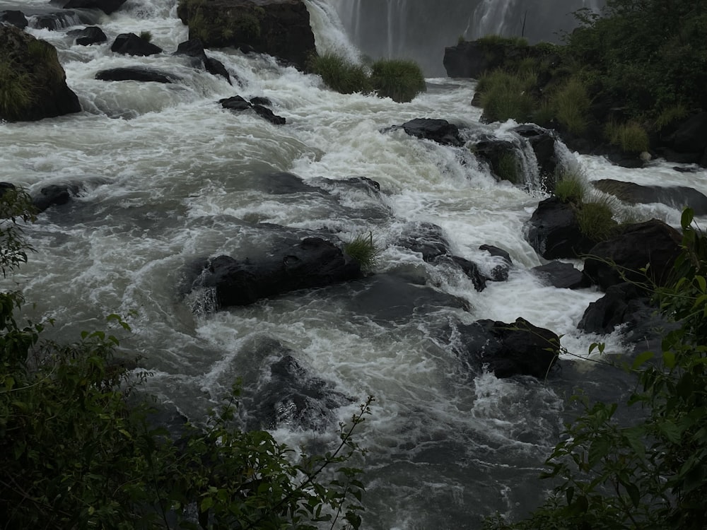 a river with a waterfall in the background