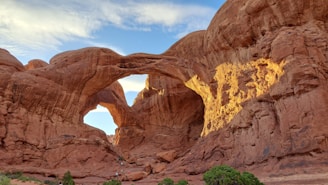 a large rock formation with an arch in the middle of it