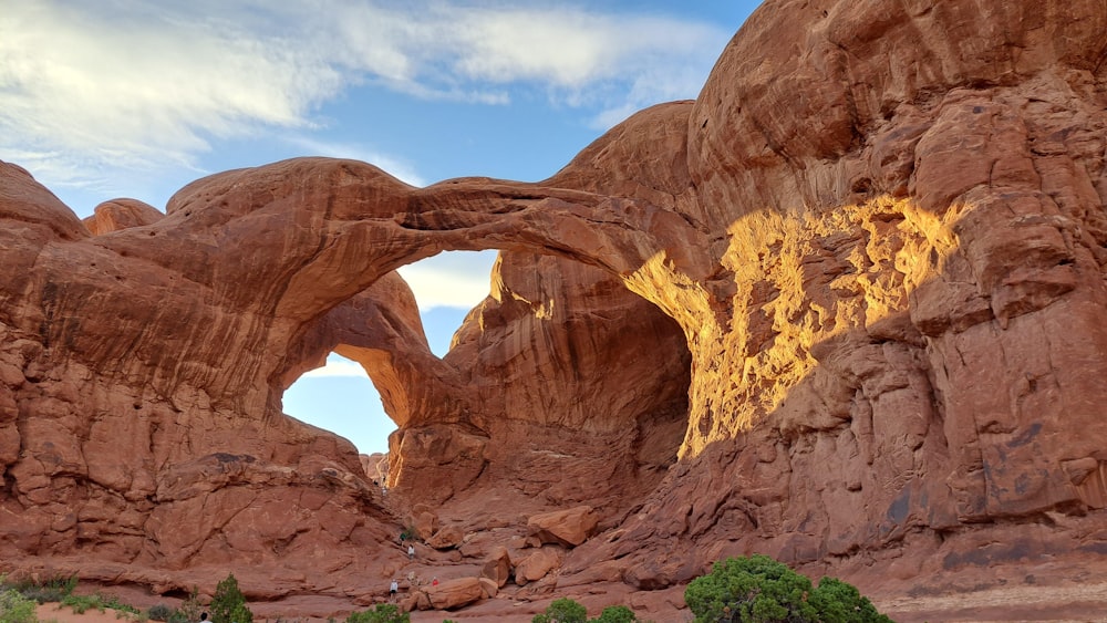 a large rock formation with an arch in the middle of it