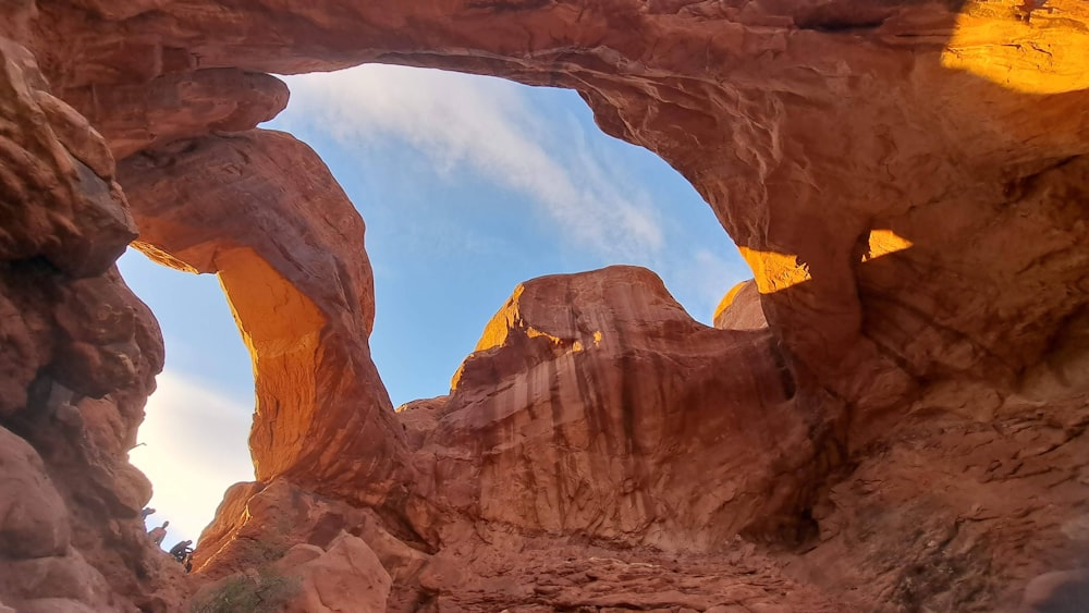 a rock formation with a sky in the background