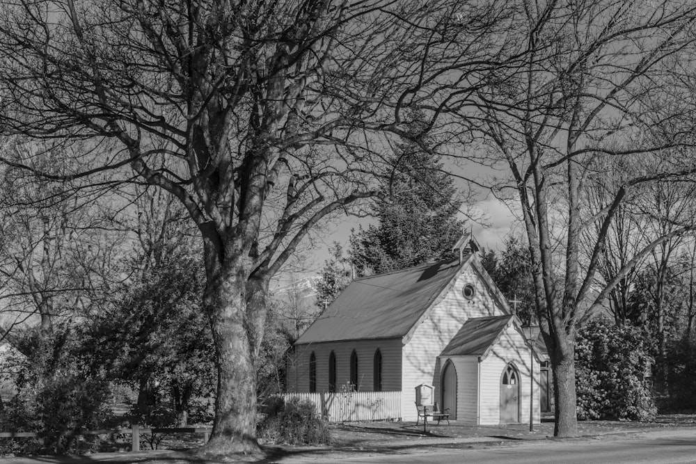 a black and white photo of a small church