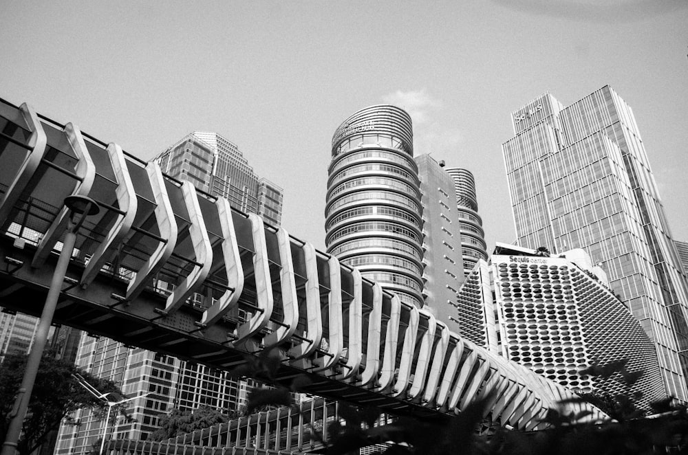 a black and white photo of a city with tall buildings