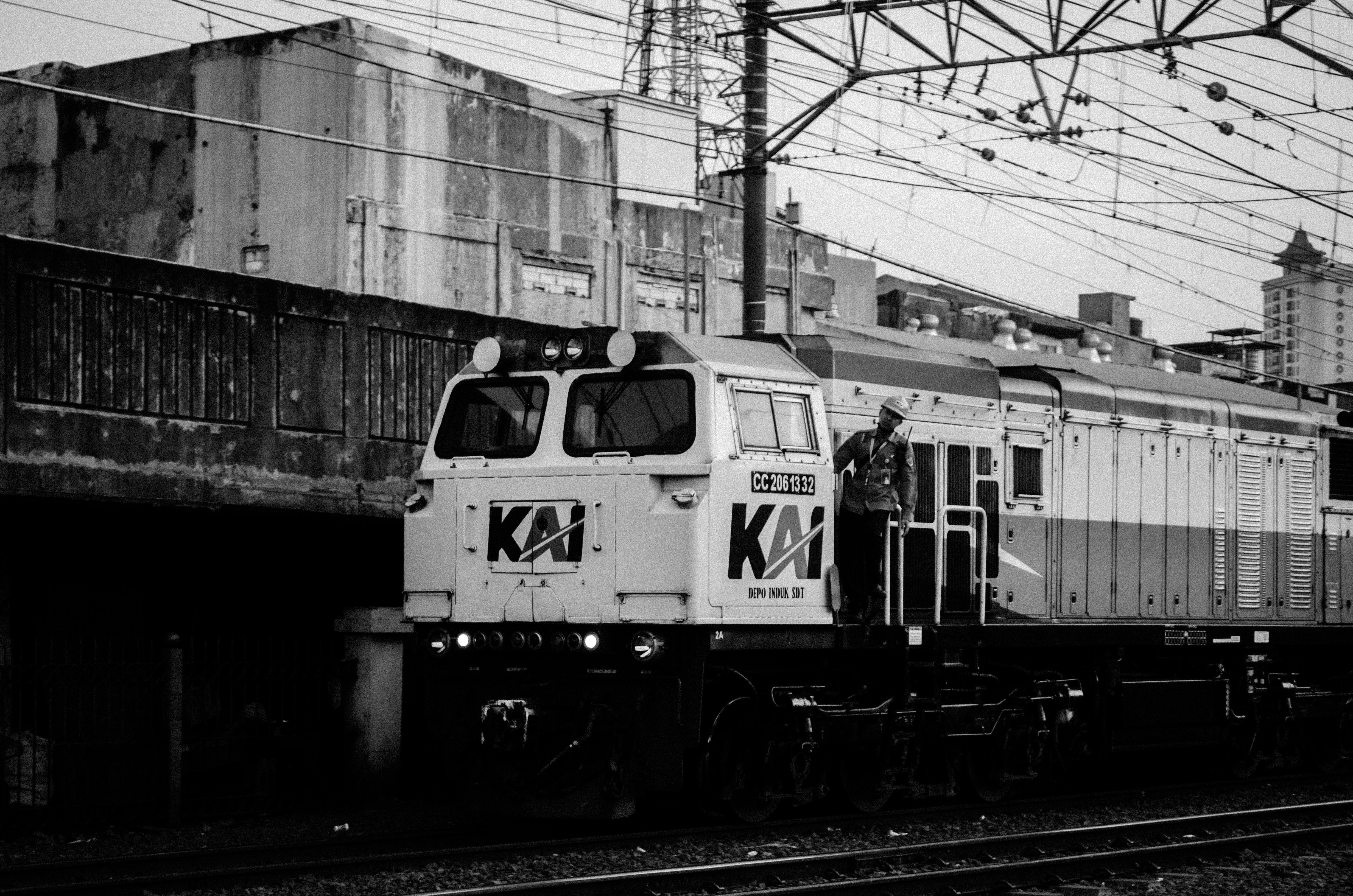 a black and white photo of a train on the tracks