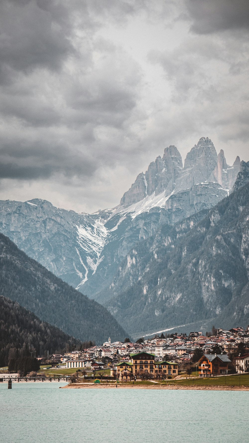 a view of a mountain range with a village in the foreground