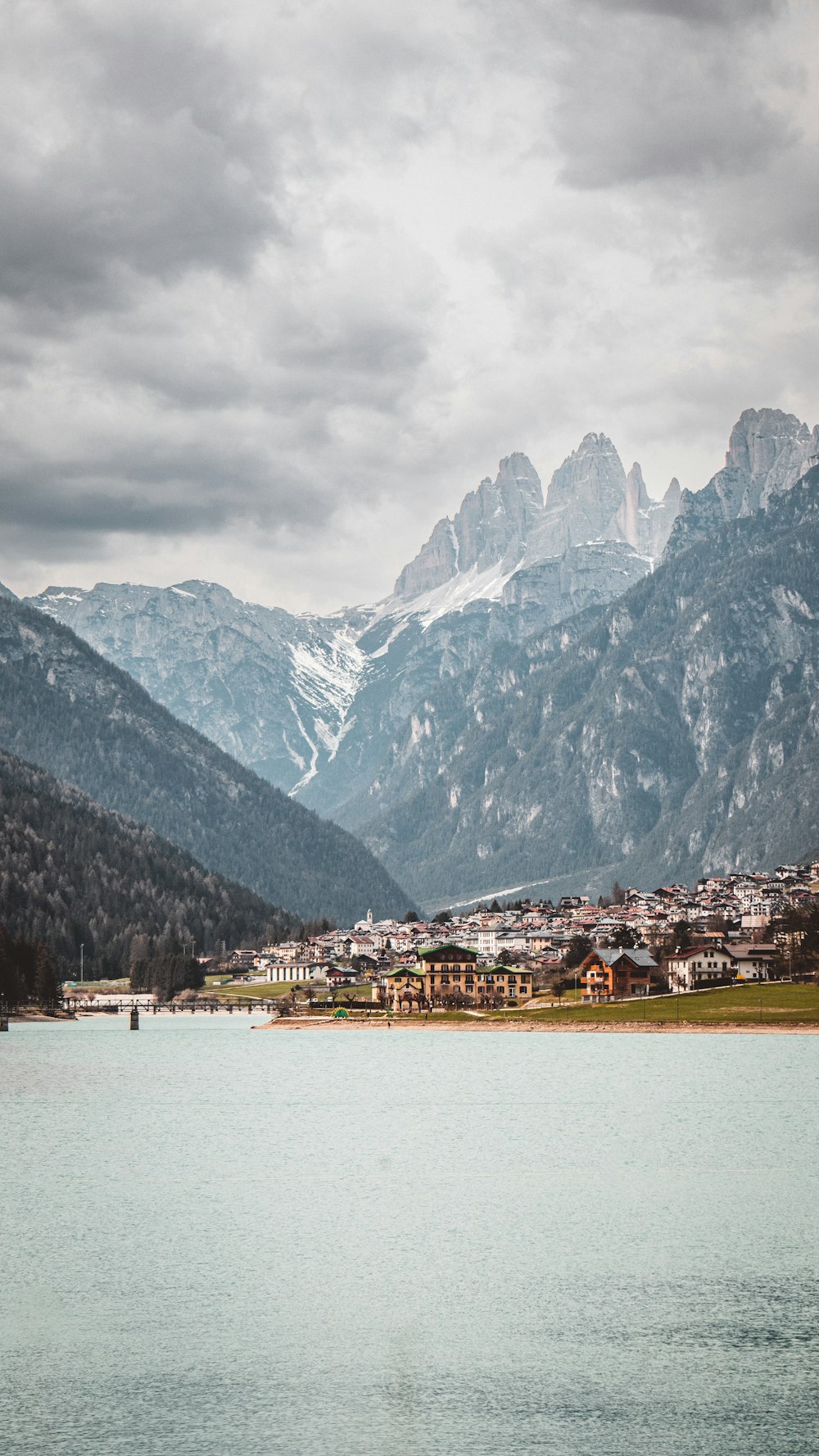 a body of water with mountains in the background