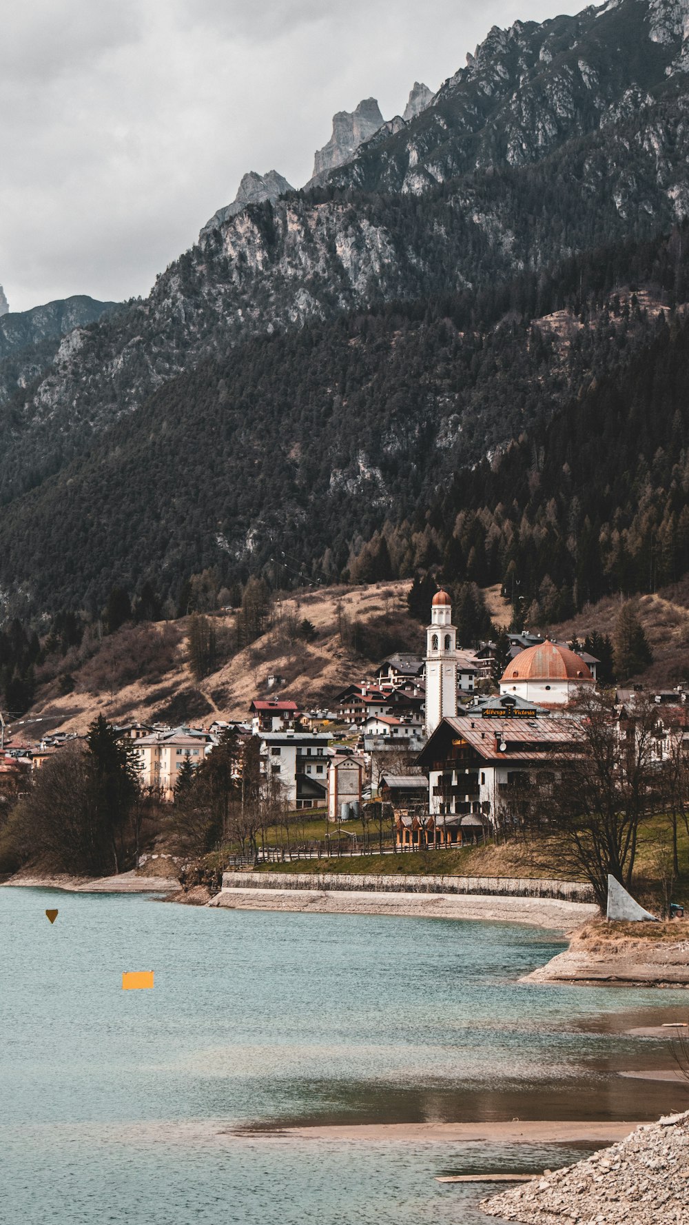 a body of water with a small town in the background