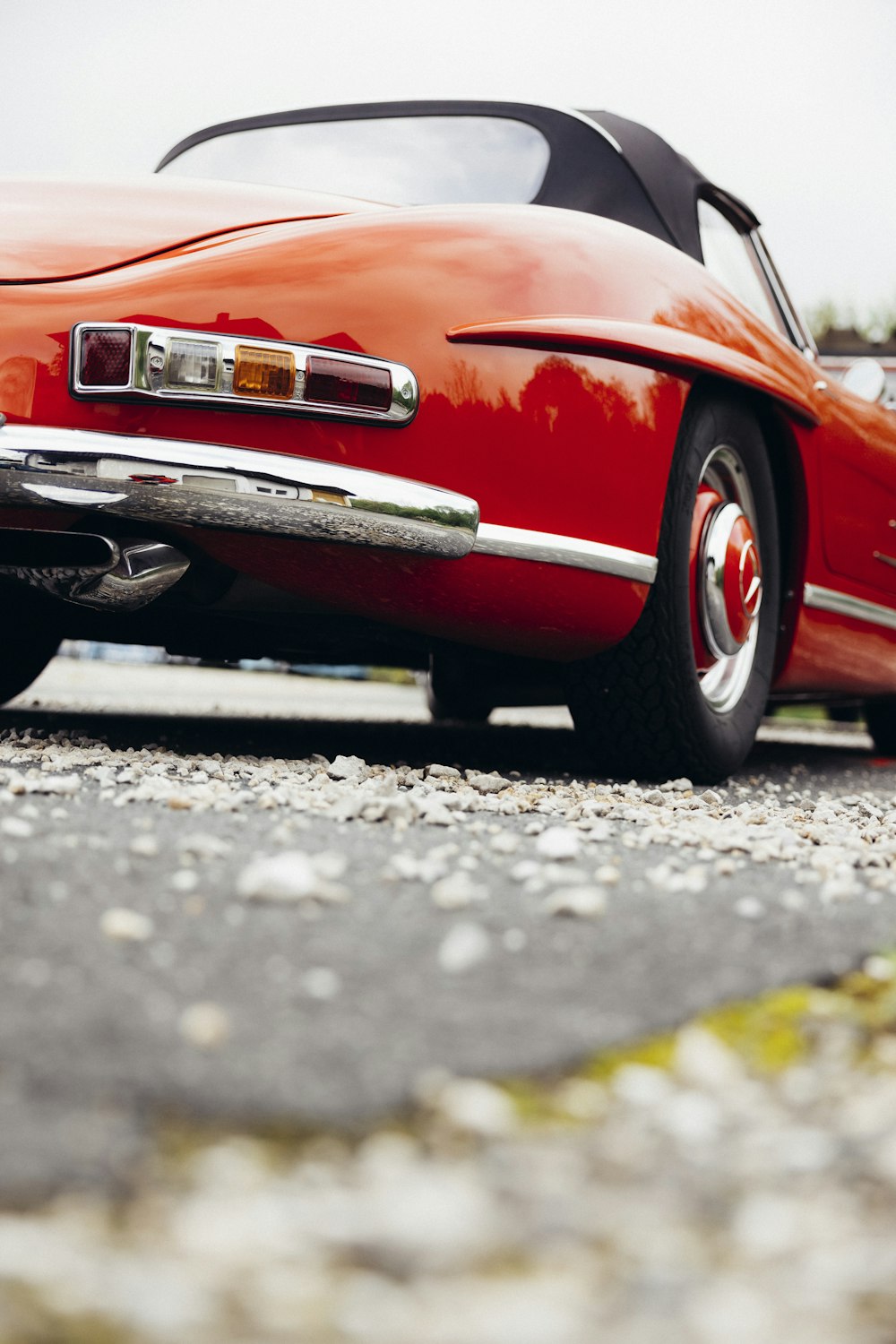 a red sports car parked on the side of the road