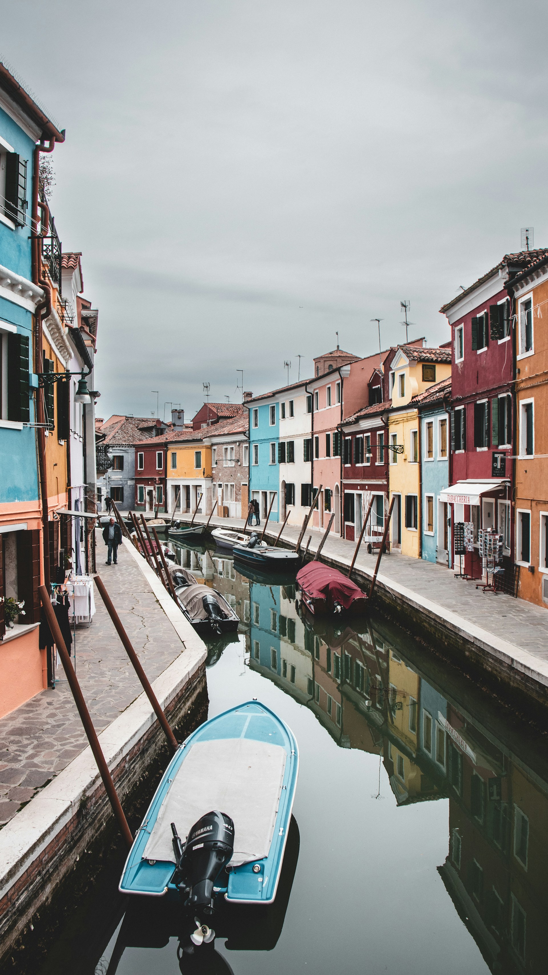 a row of houses next to a body of water