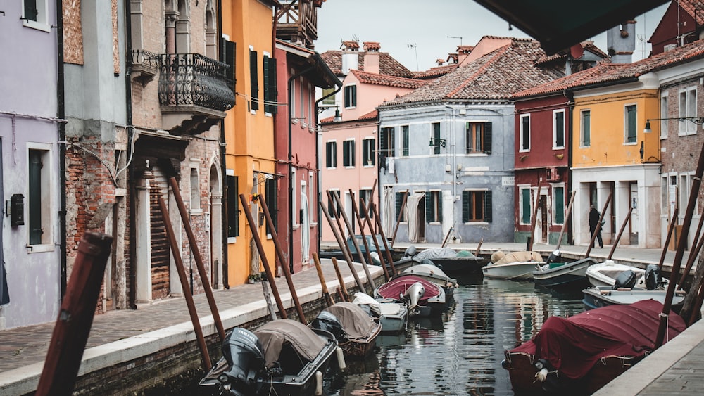 a canal with several small boats in it