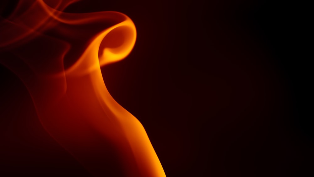 a close up of a red and yellow smoke