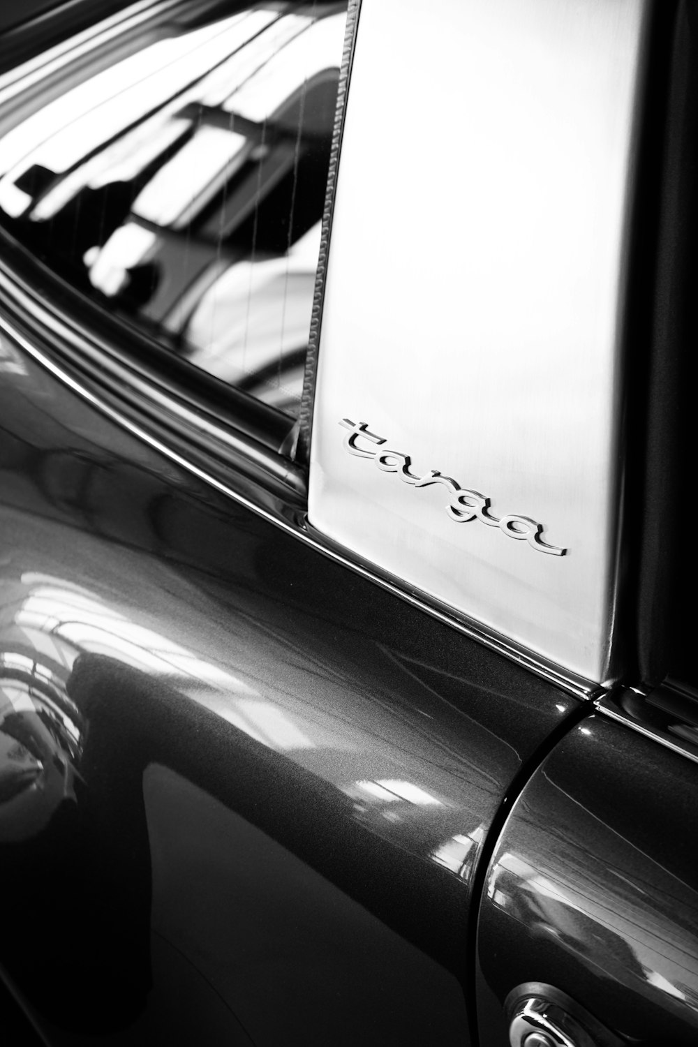 a black and white photo of a car door